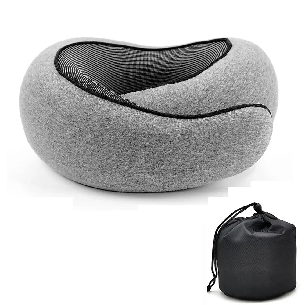 Gray ergonomic travel pillow from BYSHOPIMA with portable storage bag on white background